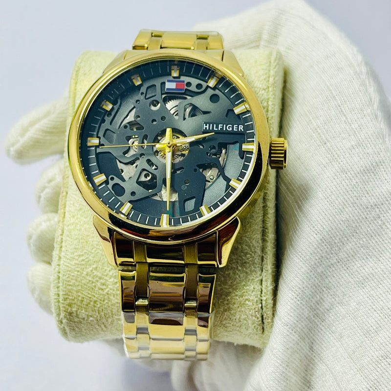 Luxury Skeleton Gold Automatic Watch for Men – Tommy-Inspired Design with Black Dial & Exposed Movement – Gold Stainless Steel Band